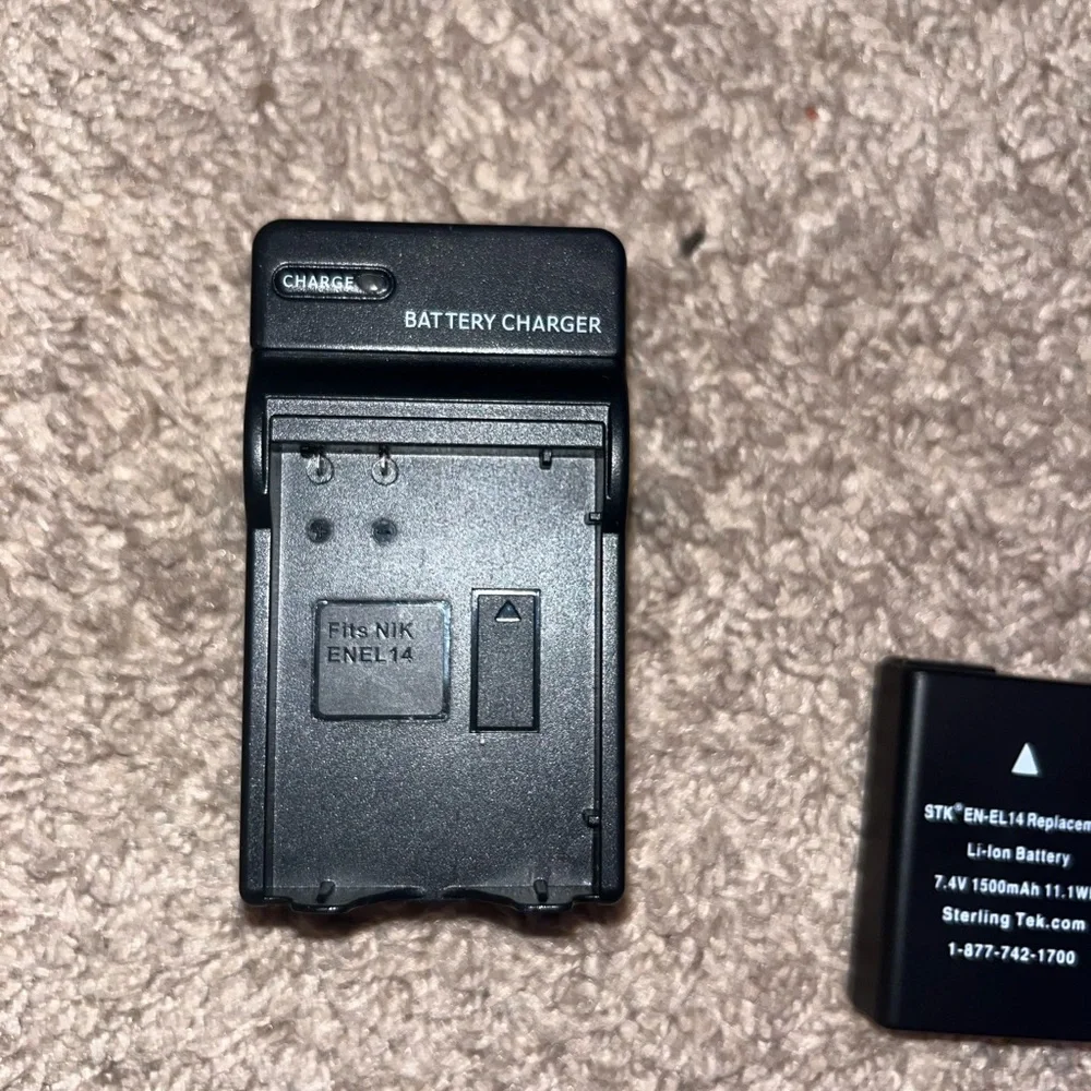 Nikon D3200 Camera. Includes Battery, 3 Nikon Lenses, Battery Charger, and Case.